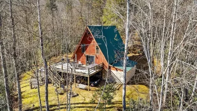 Photo of Nestled near the Blue Ridge Parkway and bordering the Pisgah National Forest, this classic A-frame home on nearly 14 acres in Western North Carolina is a picturesque retreat. $299,000