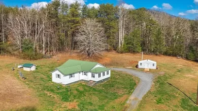 Photo of Beautiful renovated 1930’s farmhouse with modern features while still maintaining its rustic and historical charm sits on 5 unrestricted acres. $279,900