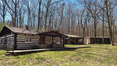 Photo of Log cabin with two outbuildings! Five acres in Missouri. Circa 1940. $125,000
