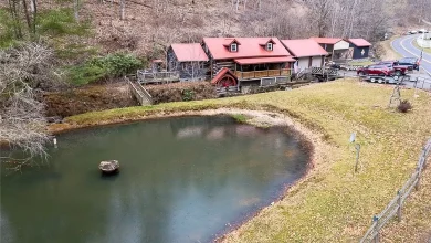 Photo of HISTORICAL CABIN WITH LARGE RUSHING CREEK AND WATERFALL RIGHT OFF THE FRONT PORCH THAT FEEDS INTO A LARGE POND. $329,900
